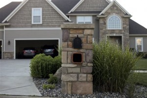 The Kalamazoo County Road Commission sent letters to 25 residents of Texas Township, Mich. telling them they need to take down their stone mailboxes. The letters said they cause a driving hazard. (Daytona Niles/Kalamazoo Gazette via AP) ALL LOCAL TV OUT AND LOCAL TV INTERNET OUT
